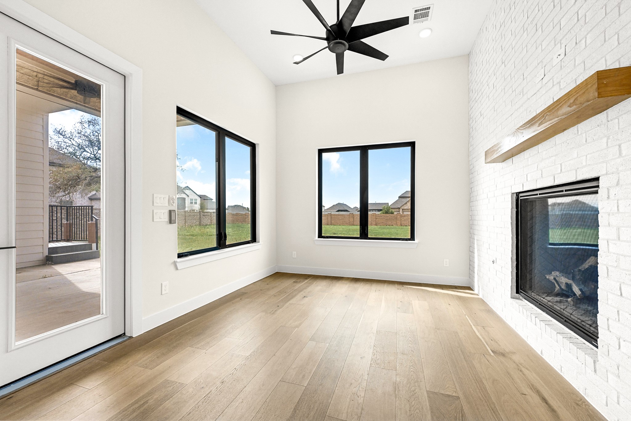 21230 Adriatic Run Drive Cypress, TX 77433 - Photo 18 of 50 a view of an empty room with wooden floor and a window