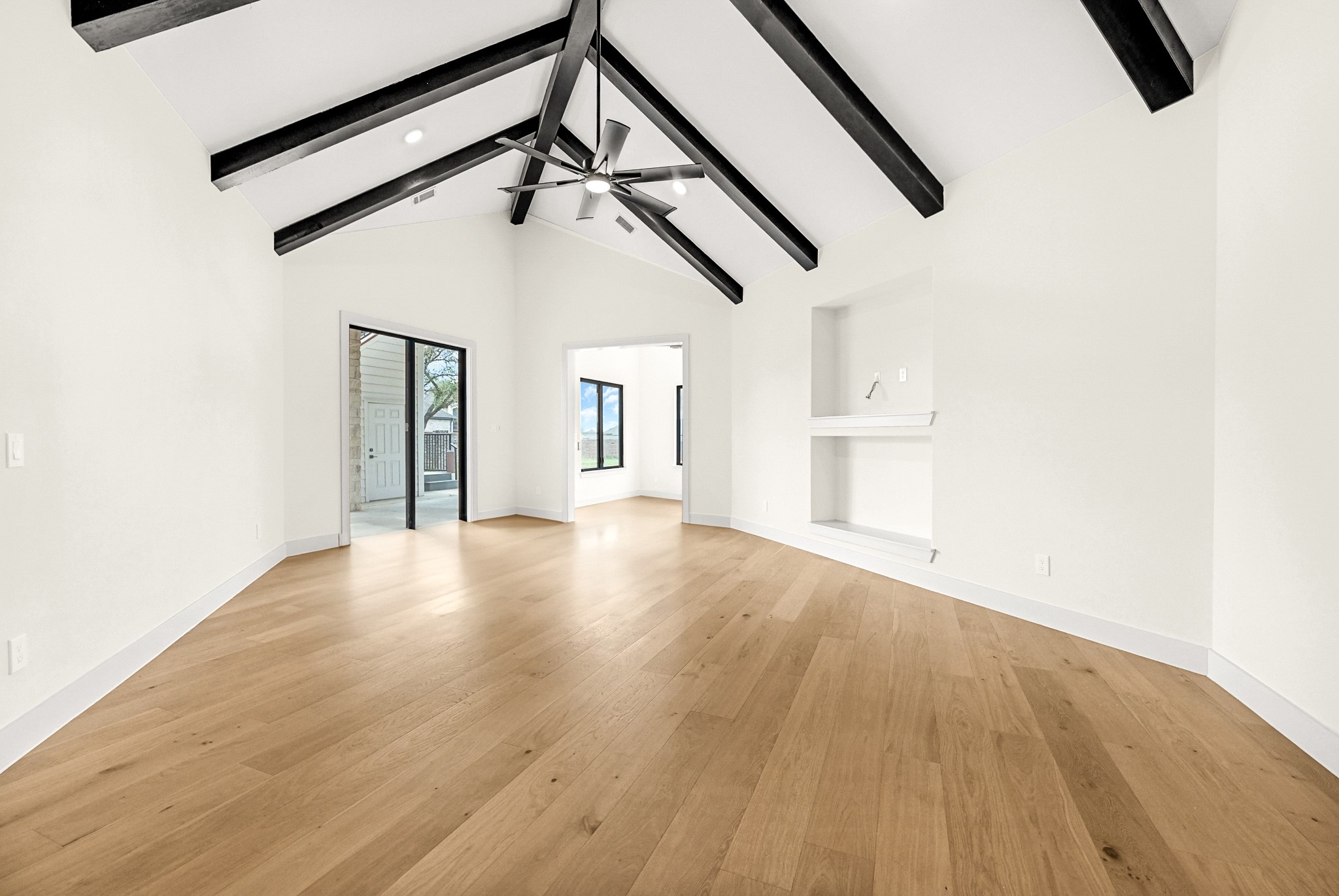 21230 Adriatic Run Drive Cypress, TX 77433 - Photo 19 of 50 an empty room with wooden floor and windows