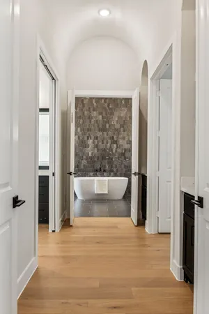 a large spacious bathroom with a double vanity sink a mirror and a bathtub