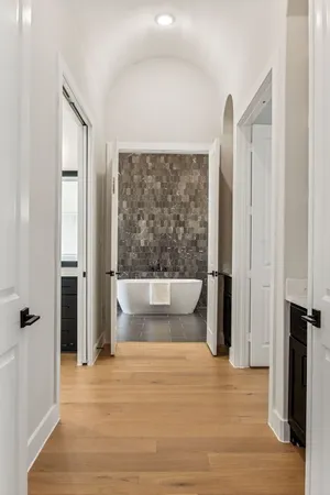 a view of a livingroom with a ceiling fan and window