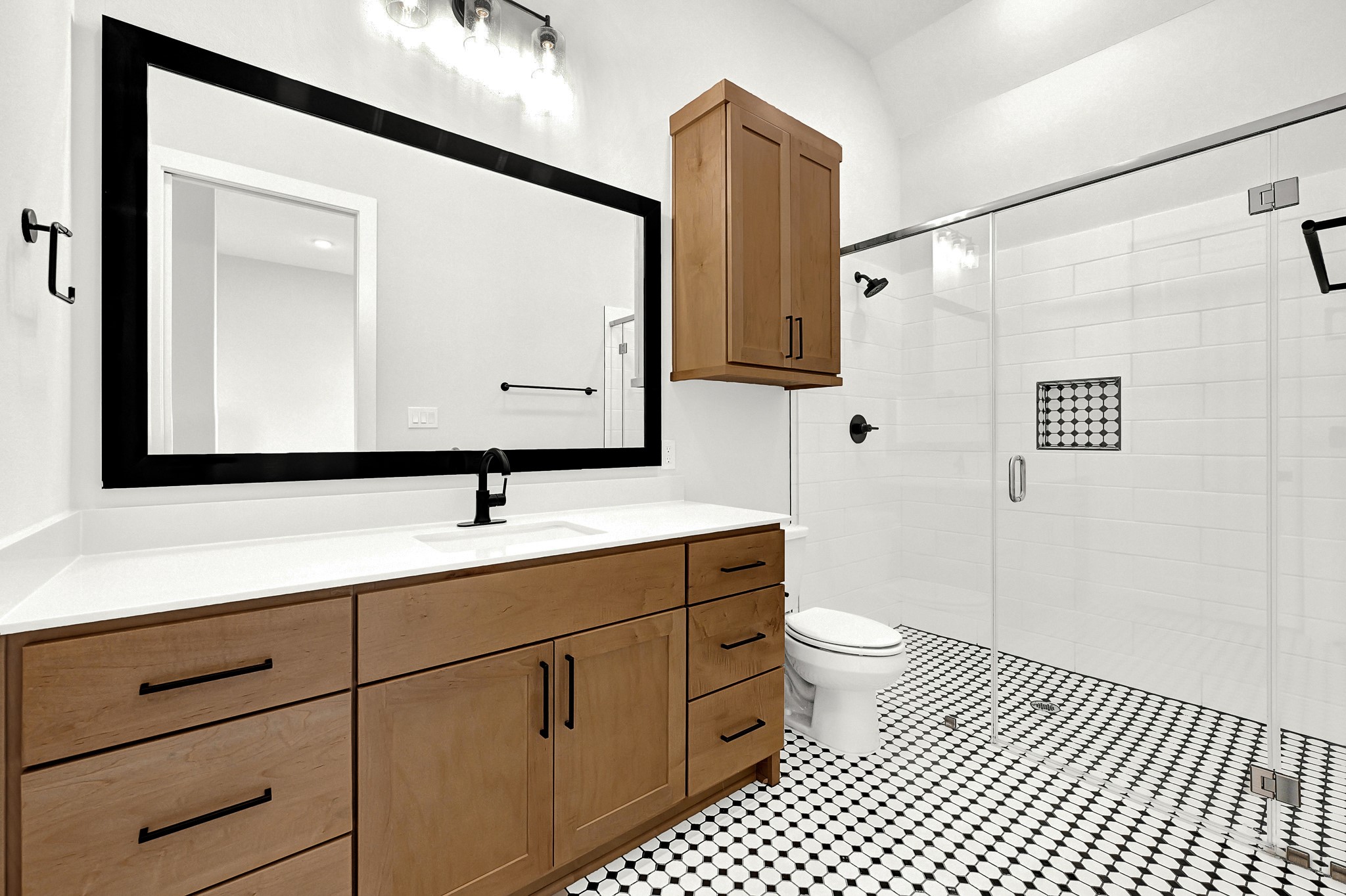 21230 Adriatic Run Drive Cypress, TX 77433 - Photo 27 of 50 a bathroom with a sink a toilet a mirror and shower