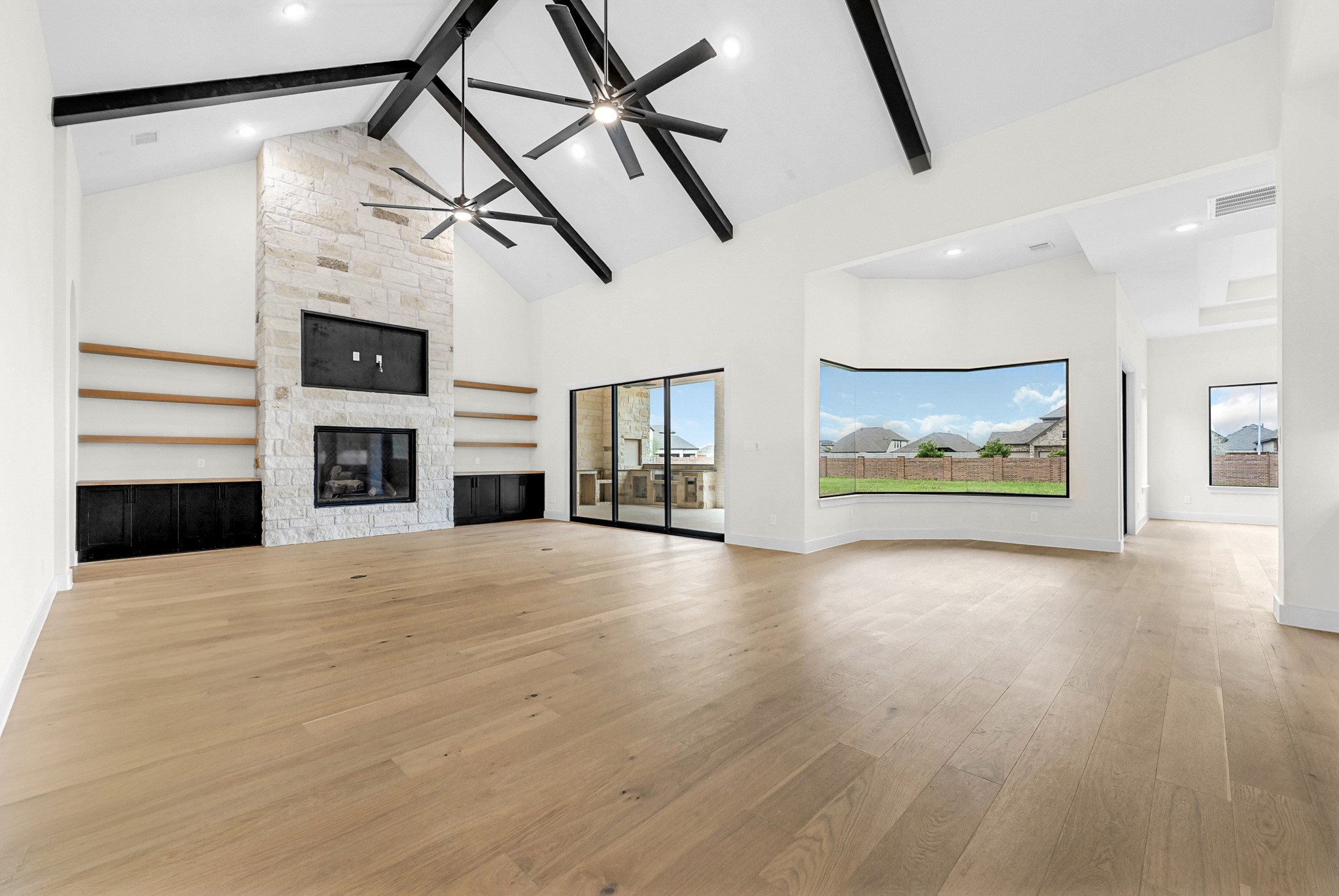21230 Adriatic Run Drive Cypress, TX 77433 - Photo 5 of 50 a view of empty room with fireplace and wooden floor