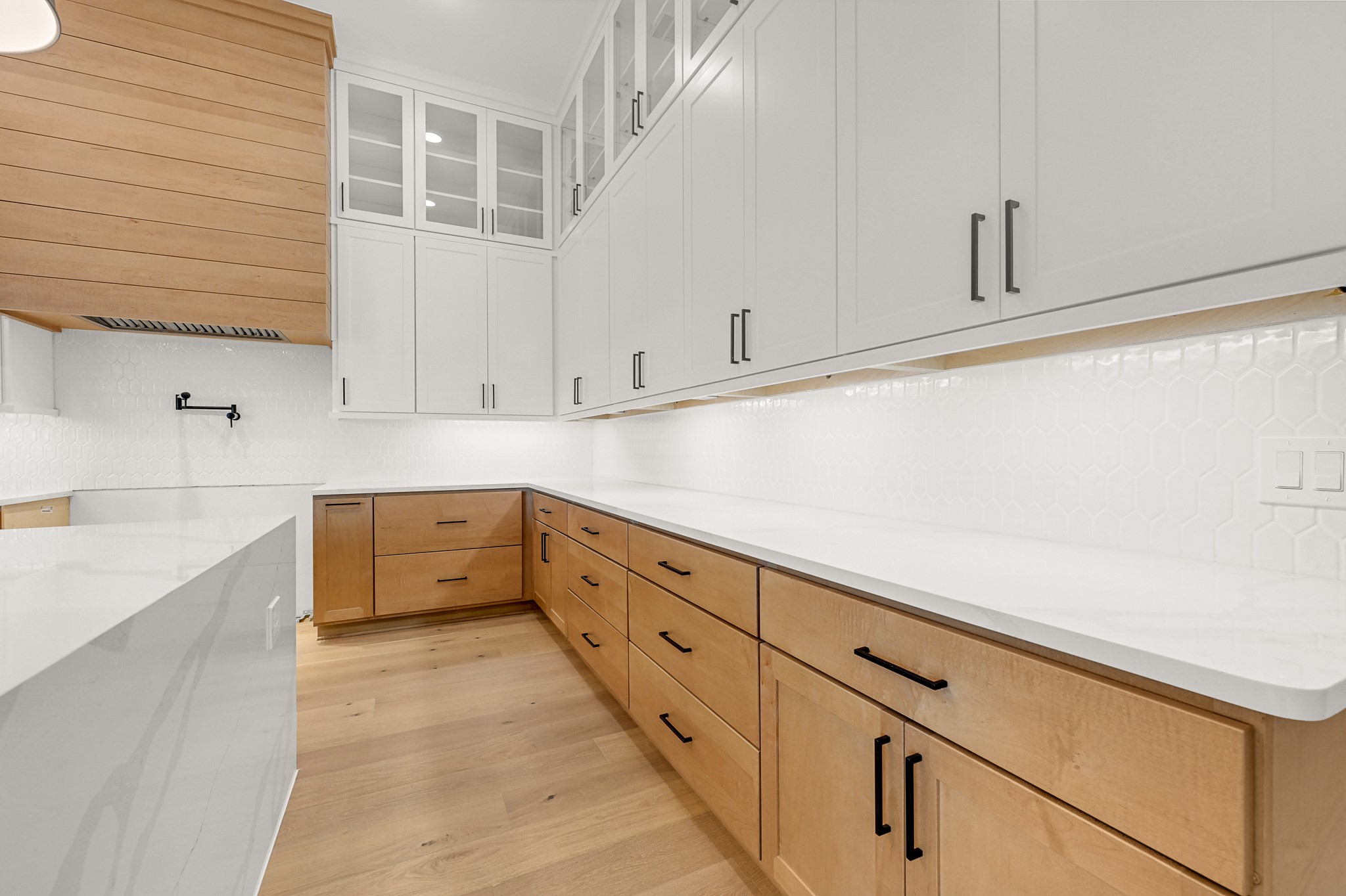 21230 Adriatic Run Drive Cypress, TX 77433 - Photo 9 of 50 a kitchen with granite countertop white cabinets and white appliances