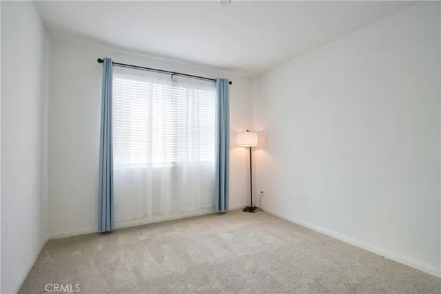 a view of a hallway with windows