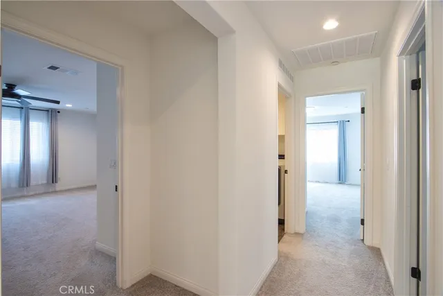 a view of bathroom with a sink and mirror