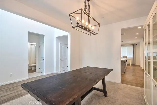 a large kitchen with granite countertop a large counter top stainless steel appliances and cabinets