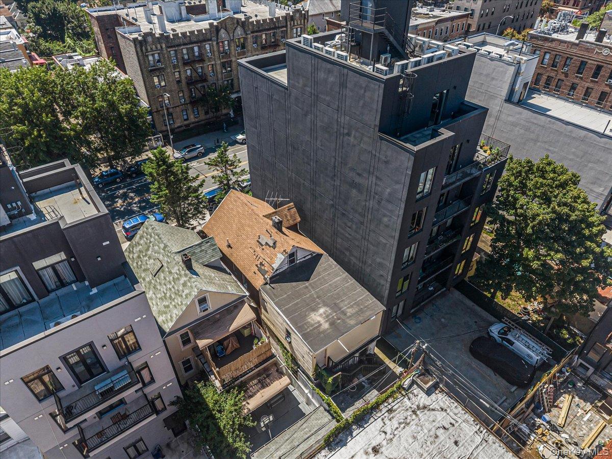 2811 Clarendon Road Brooklyn, NY 11226 - Photo 11 of 11 Multi-story building with a dark facade and multiple balconies