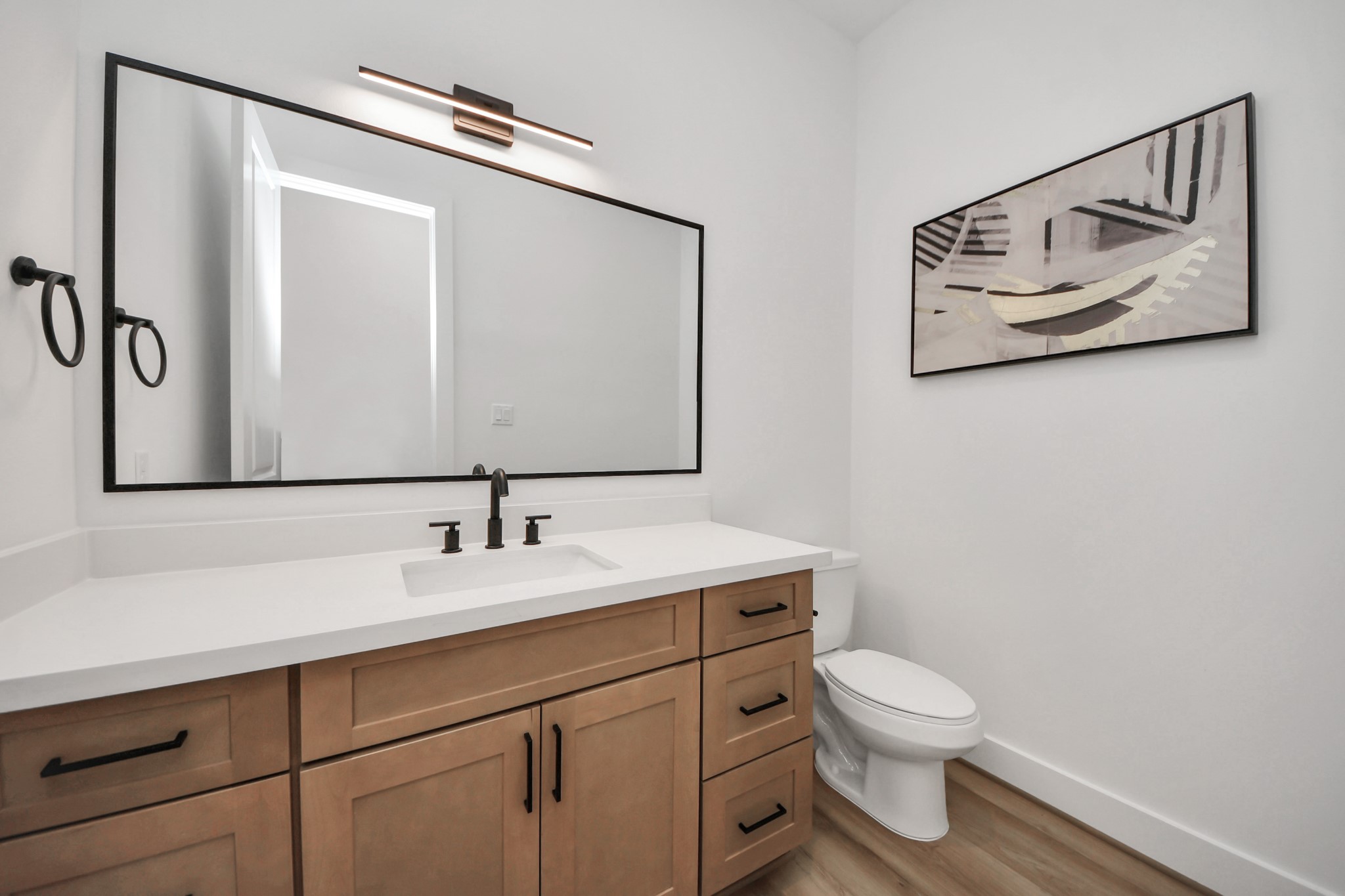505 Middle Street Houston, TX 77003 - Photo 17 of 46 Discover the convenience of a sleek half bathroom on the first floor, featuring modern fixtures and elegant design for stylish functionality.