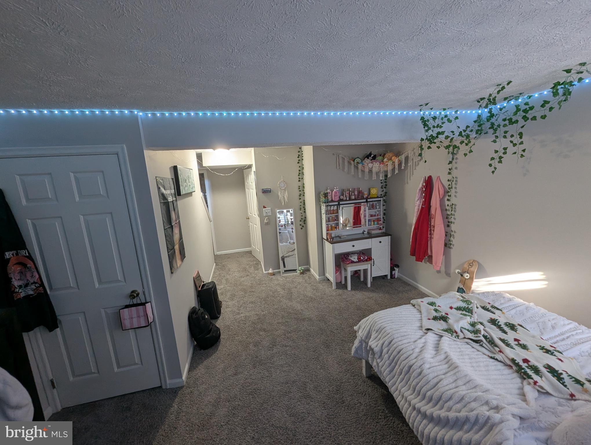 3639 Handel Court, Unit 75 Pasadena, MD 21122 - Photo 11 of 24 a bed room with a bed and a chair