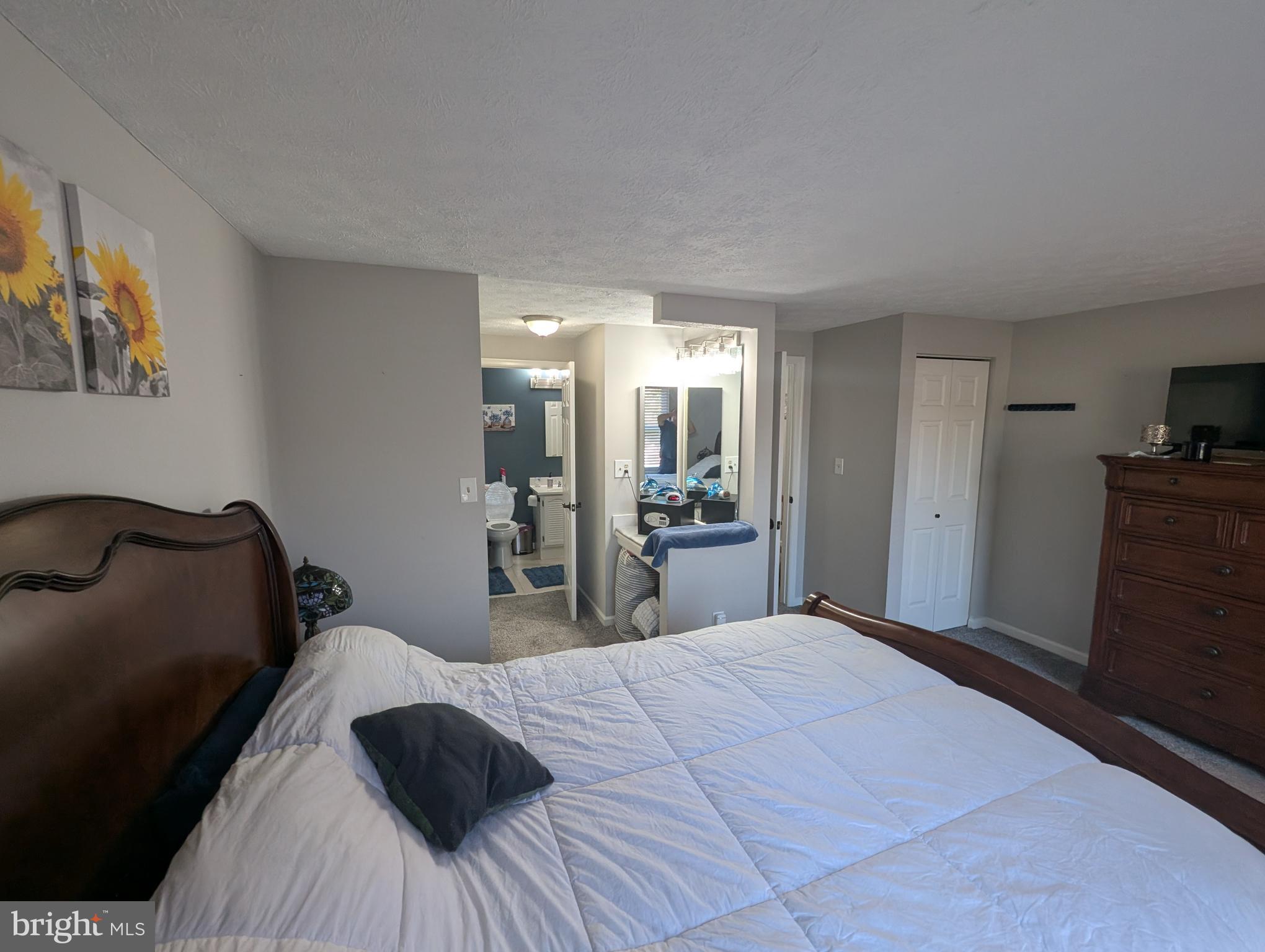 3639 Handel Court, Unit 75 Pasadena, MD 21122 - Photo 17 of 24 a bedroom with a bed and a dresser