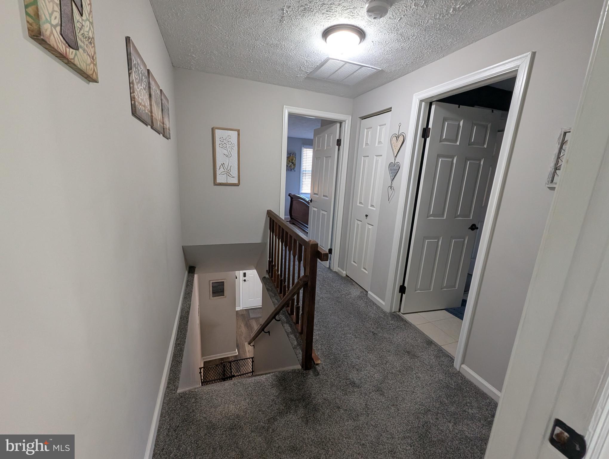 3639 Handel Court, Unit 75 Pasadena, MD 21122 - Photo 20 of 24 a view of a hallway with workspace