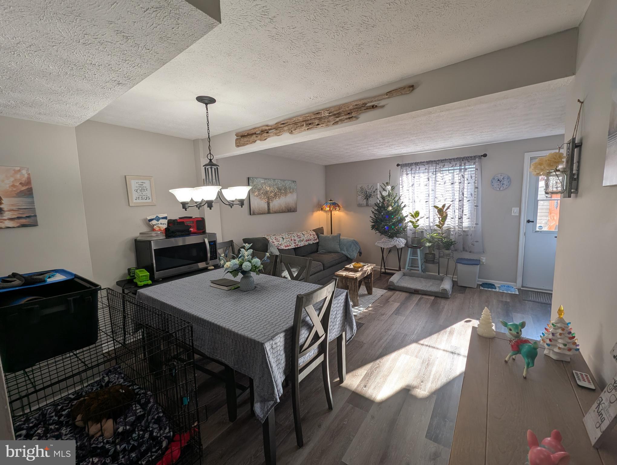 3639 Handel Court, Unit 75 Pasadena, MD 21122 - Photo 2 of 24 a view of a dining room with furniture and wooden floor