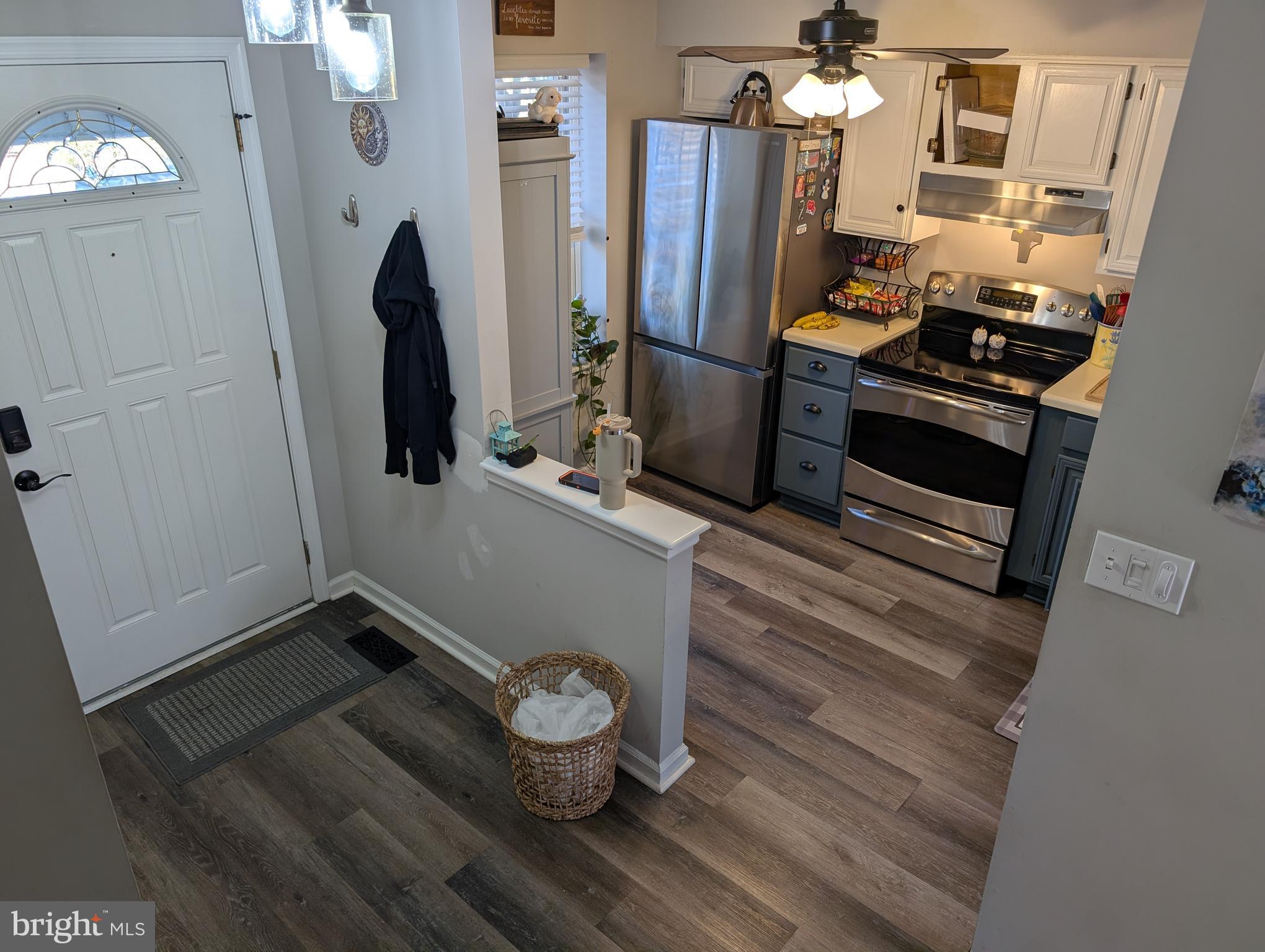 3639 Handel Court, Unit 75 Pasadena, MD 21122 - Photo 21 of 24 a room with wooden floor and furniture