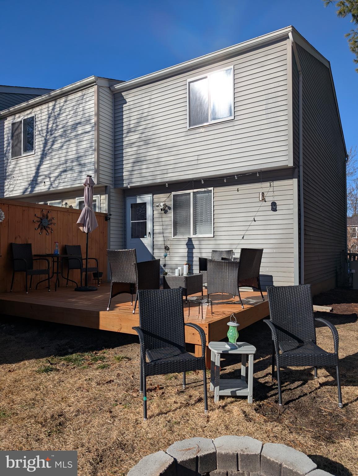 3639 Handel Court, Unit 75 Pasadena, MD 21122 - Photo 22 of 24 a backyard of a house with outdoor seating