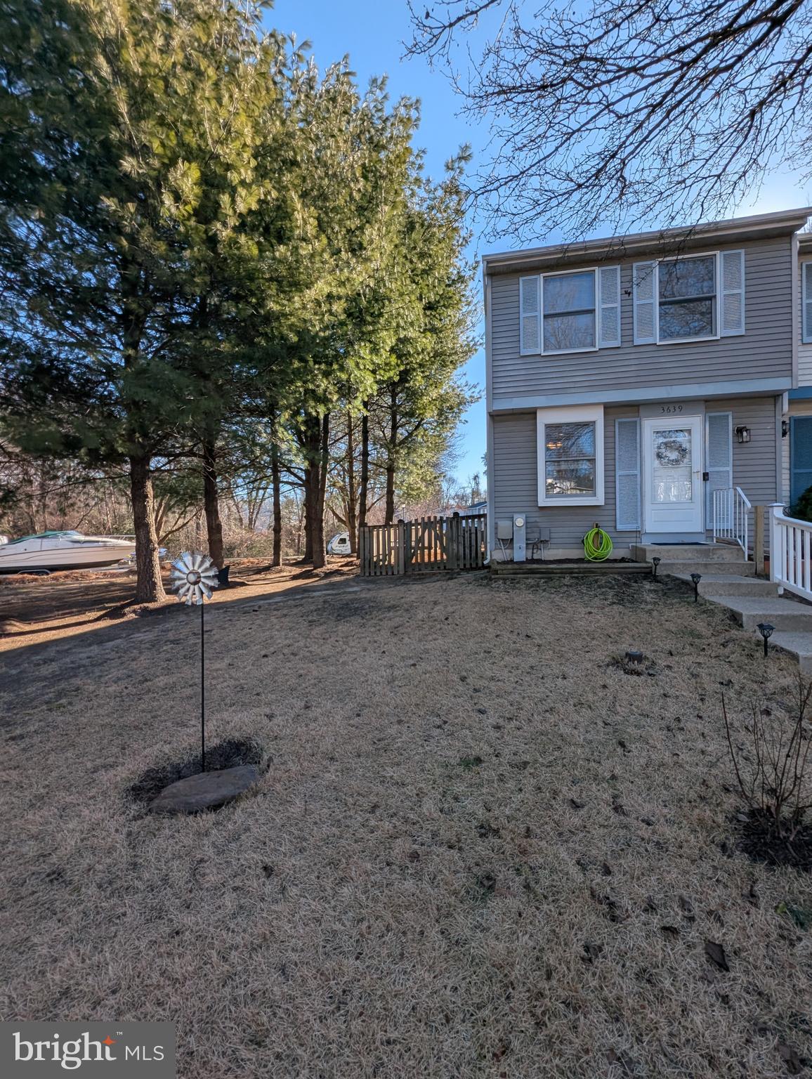 3639 Handel Court, Unit 75 Pasadena, MD 21122 - Photo 23 of 24 a view of a yard in front of a house