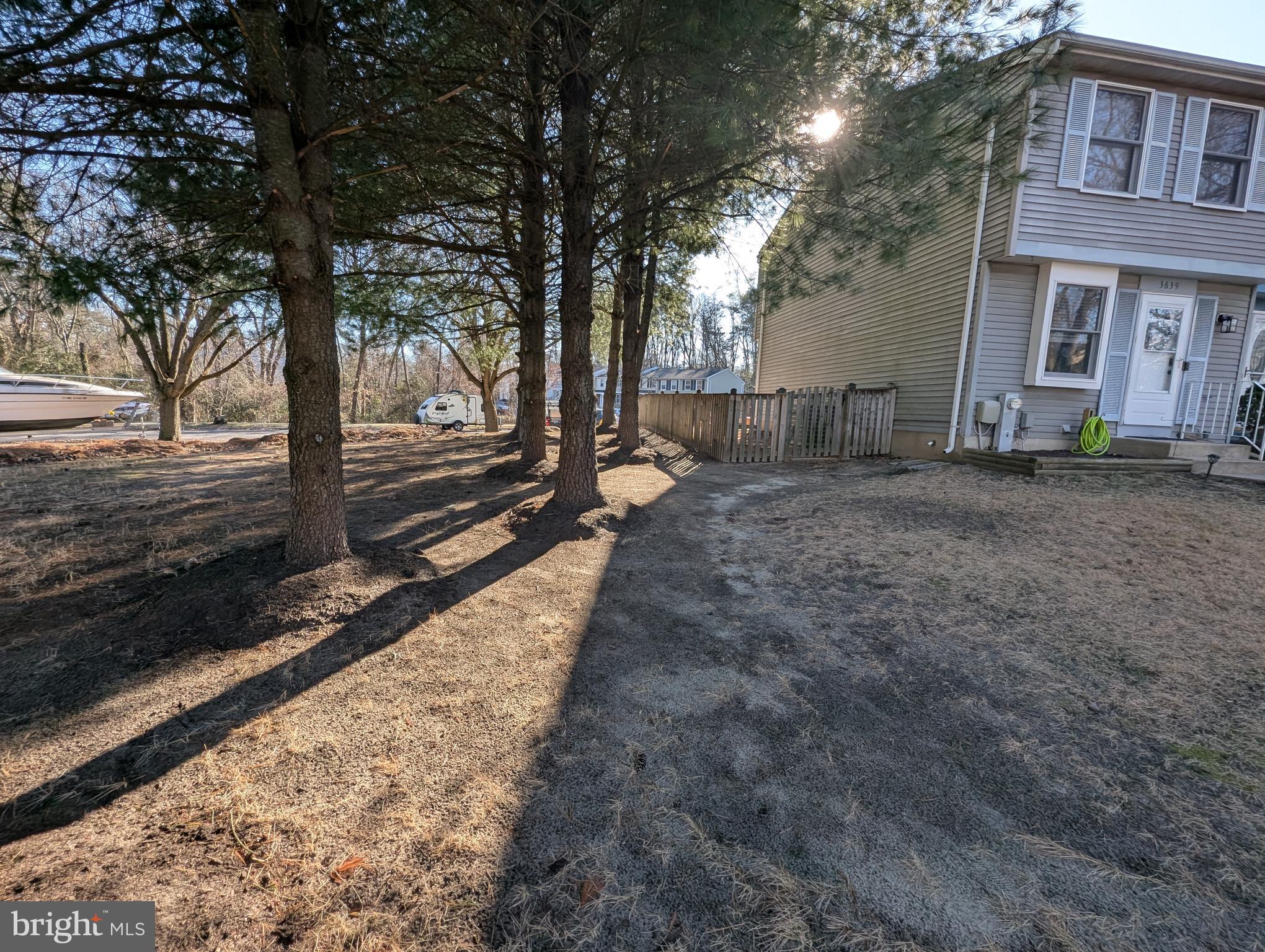 3639 Handel Court, Unit 75 Pasadena, MD 21122 - Photo 24 of 24 a view of a yard with tree s