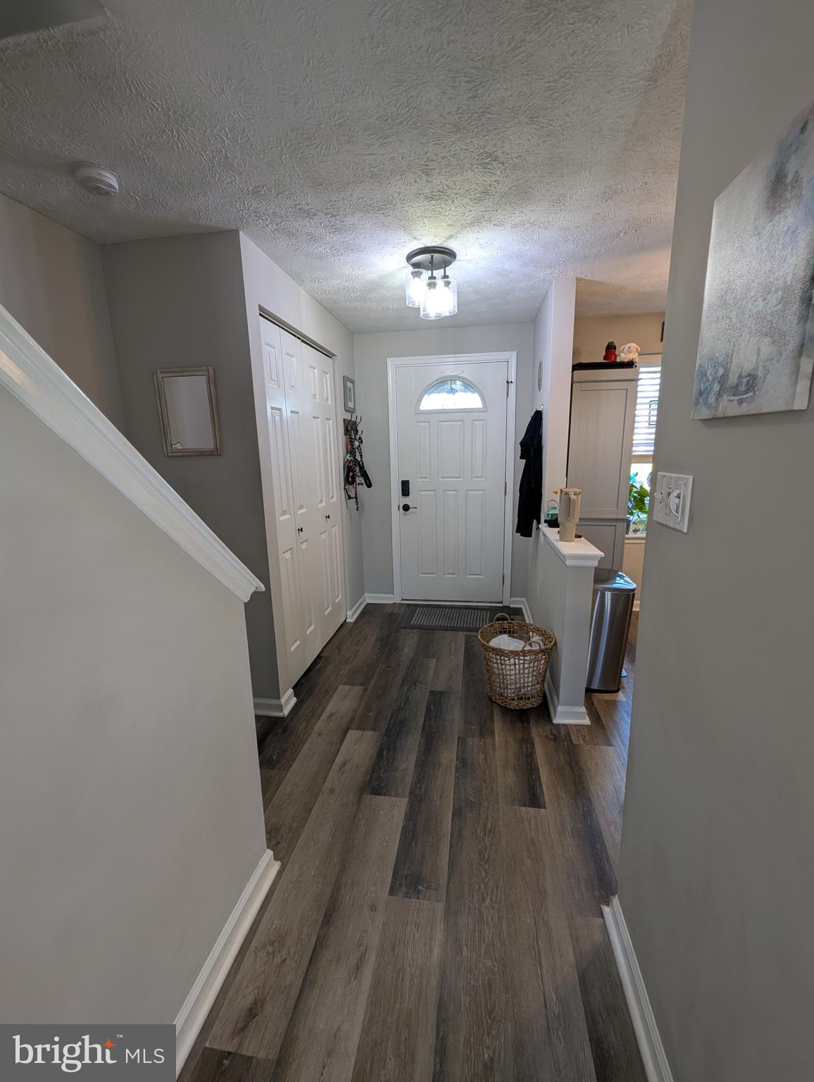 3639 Handel Court, Unit 75 Pasadena, MD 21122 - Photo 5 of 24 a view of a livingroom with furniture and wooden floor