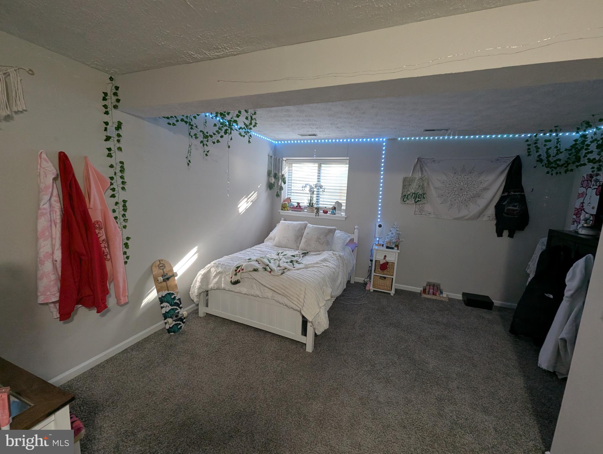 3639 Handel Court, Unit 75 Pasadena, MD 21122 - Photo 9 of 24 a spacious bedroom with a bed and a window
