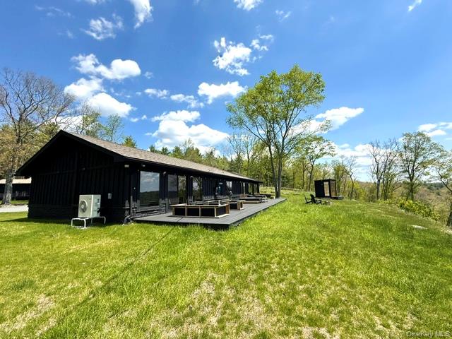 125 Mapes Road Barryville, NY 12719 - Photo 2 of 37 a view of a house with a yard and a garden
