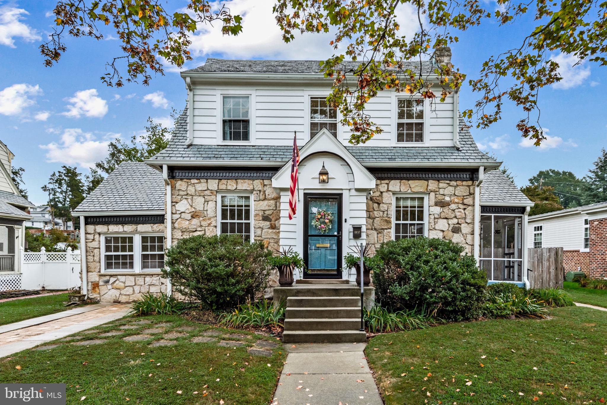Charming stone-front home with inviting entry.