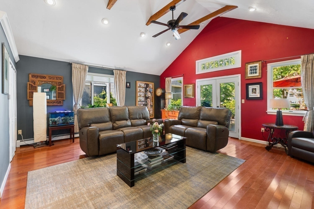 28 Gordon Road Medford, MA 02155 - Photo 11 of 41 a living room with furniture a large window and wooden floor