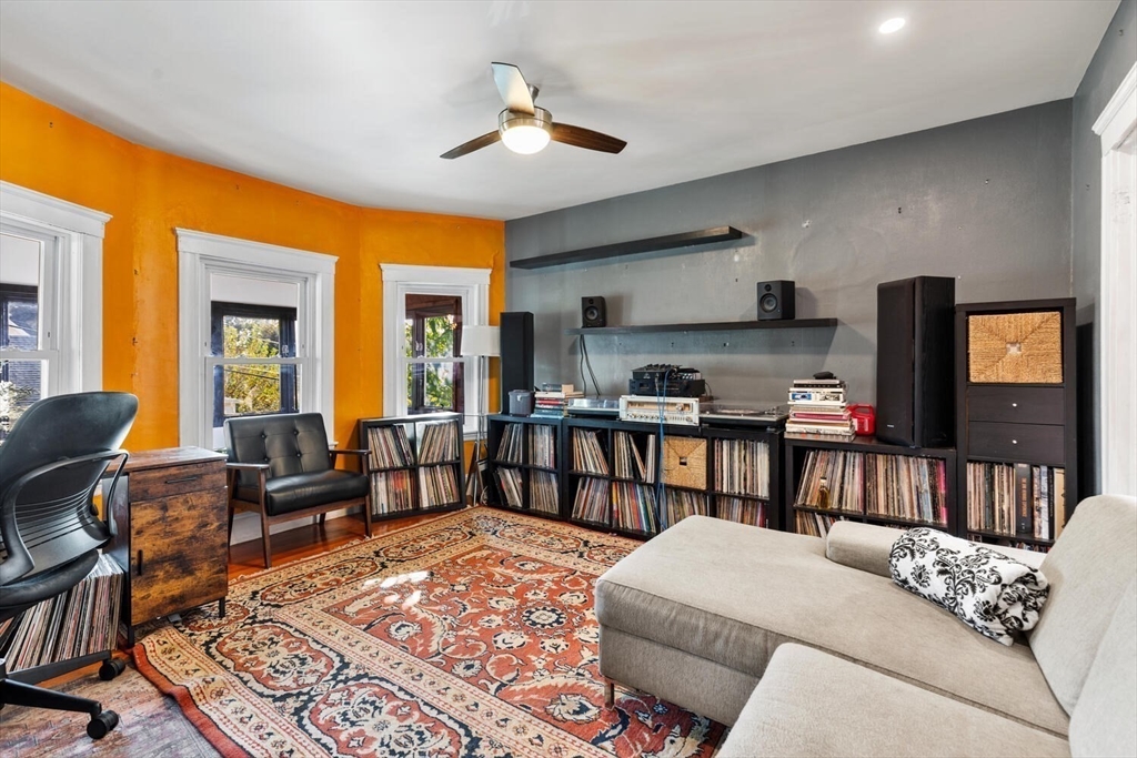 28 Gordon Road Medford, MA 02155 - Photo 18 of 41 a living room with furniture and a flat screen tv