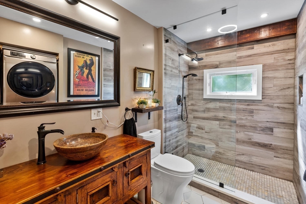28 Gordon Road Medford, MA 02155 - Photo 21 of 41 a bathroom with a toilet a sink and mirror