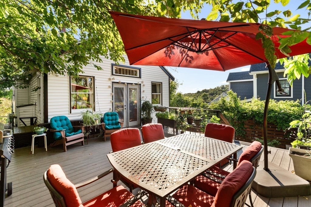 28 Gordon Road Medford, MA 02155 - Photo 33 of 41 a outdoor space with patio the couches and a umbrella