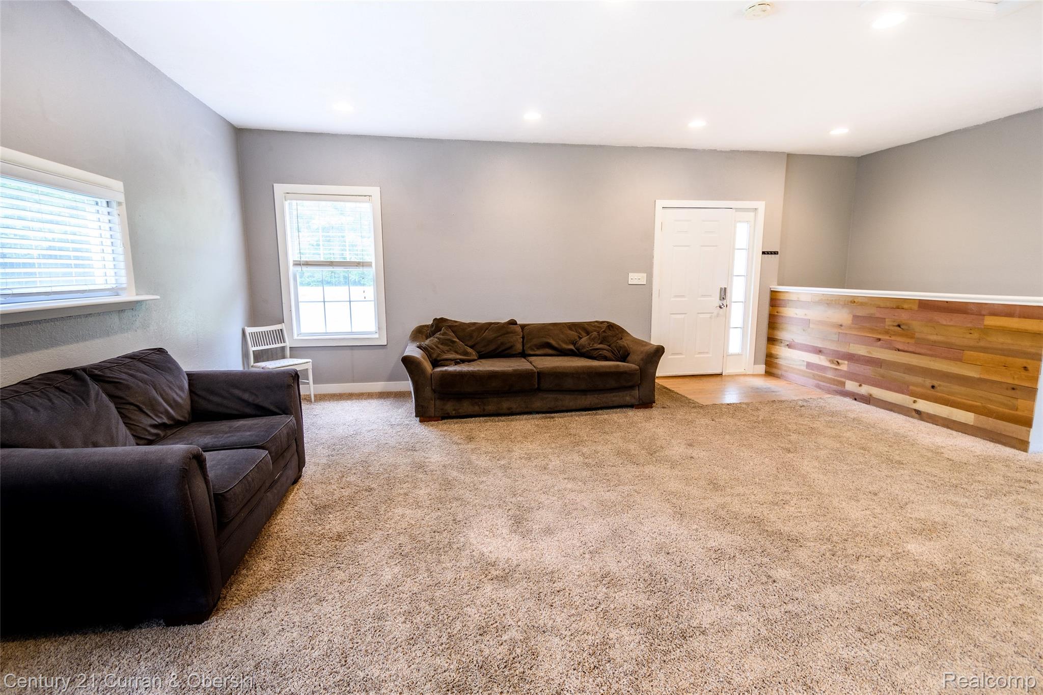 5260 Rives Junction Road Jackson, MI 49201 - Photo 17 of 44 Spacious interior featuring neutral carpeting, recessed lighting, and light gray wall finishes