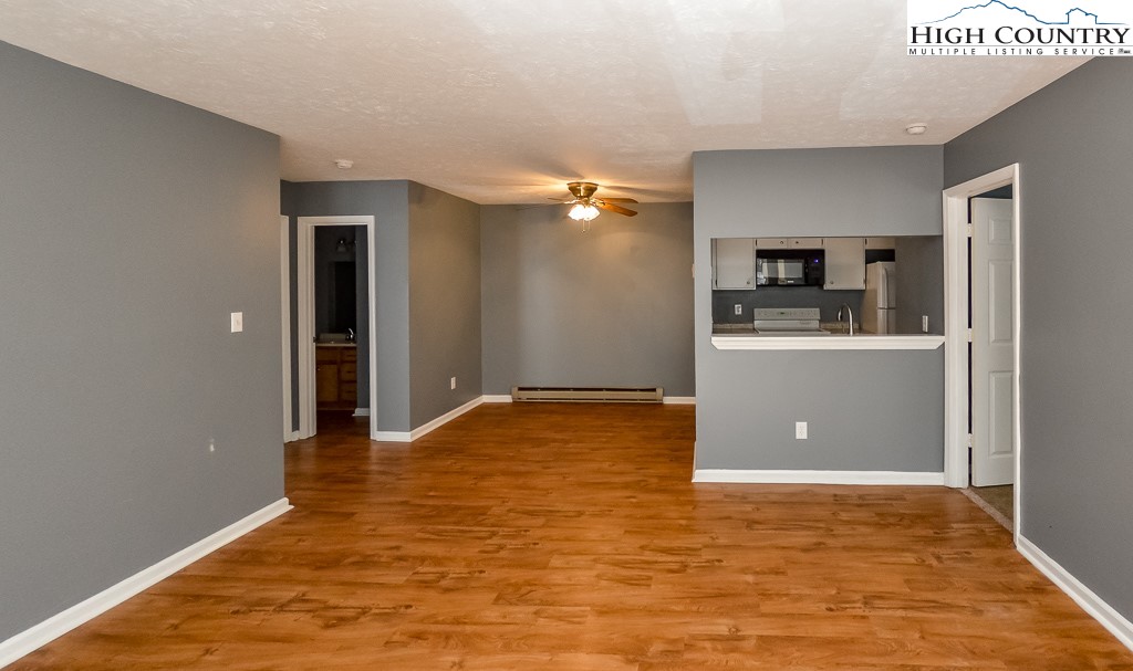 200 Pilgrims Way, Unit 25 Boone, NC 28607 - Photo 3 of 12 a view of a kitchen with a sink and a refrigerator