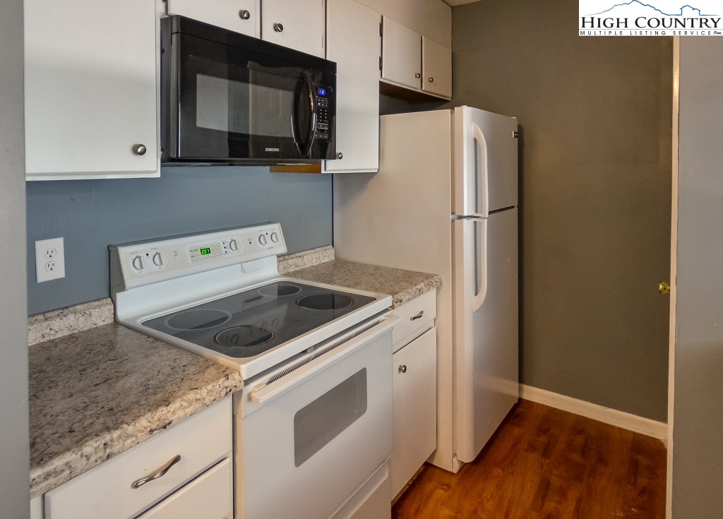200 Pilgrims Way, Unit 25 Boone, NC 28607 - Photo 5 of 12 a kitchen with a stove microwave and refrigerator