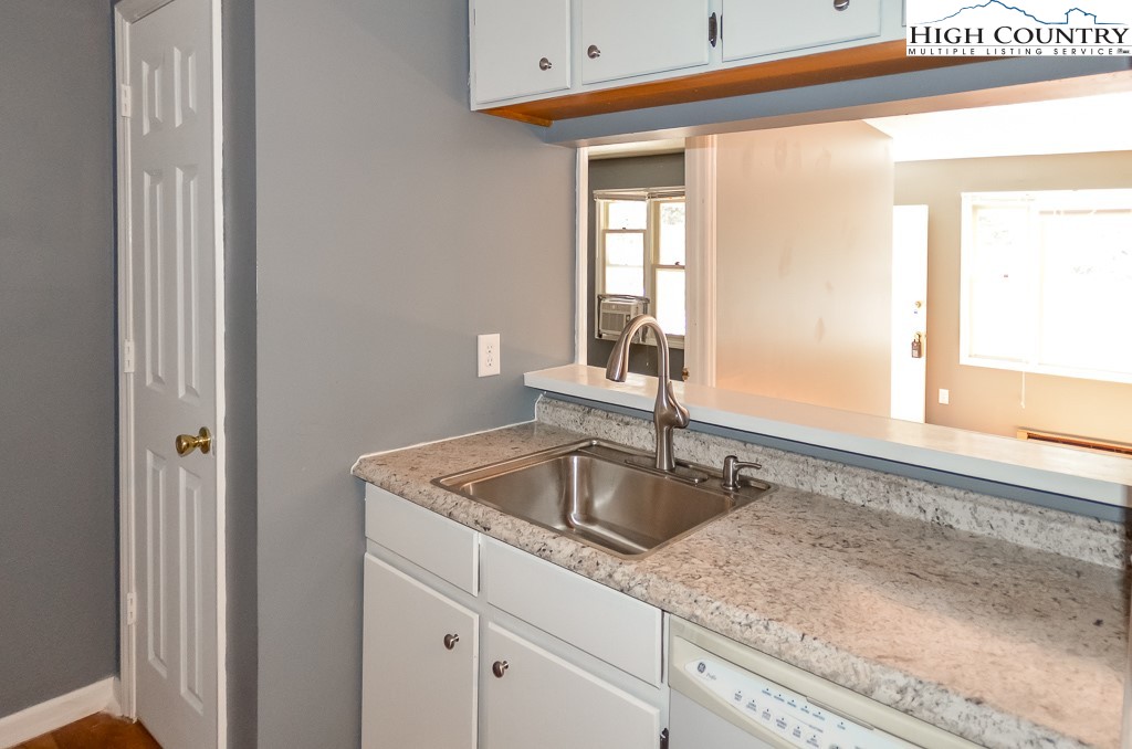 200 Pilgrims Way, Unit 25 Boone, NC 28607 - Photo 6 of 12 a kitchen with a sink and cabinets