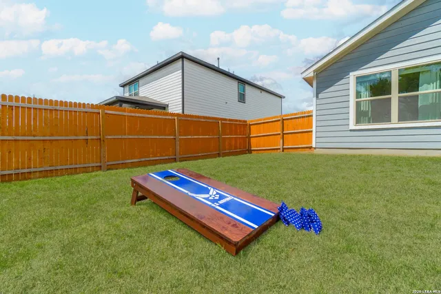 a view of a backyard with a large pool