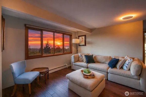 a living room with furniture and a large window