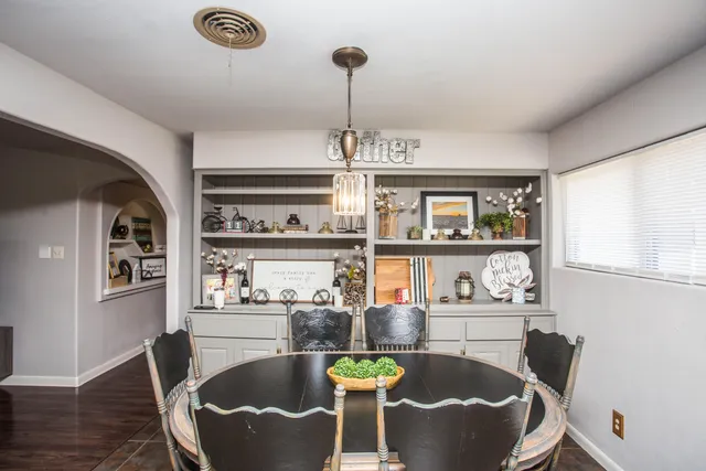 a dining room with furniture and window