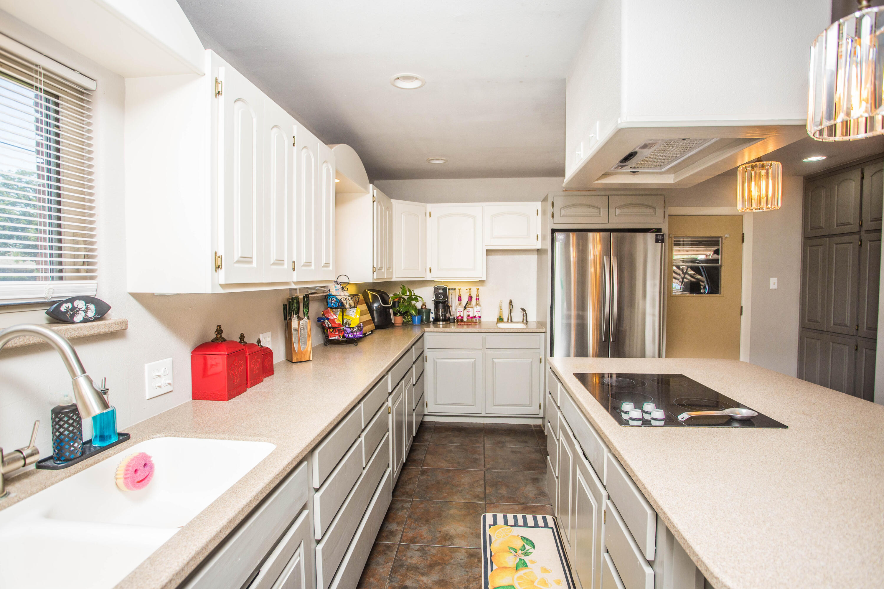 812 1st Street Abernathy, TX 79311 - Photo 15 of 53 a kitchen with a sink stove and cabinets