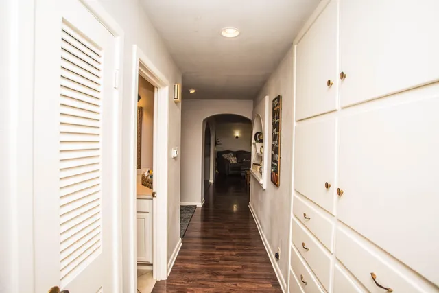a view of a hallway with a white walls