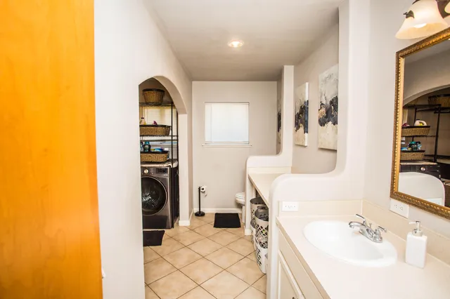a en suite bathroom with a sink and a tub