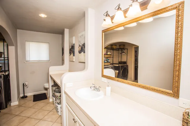 a bathroom with a sink a mirror and a bathtub