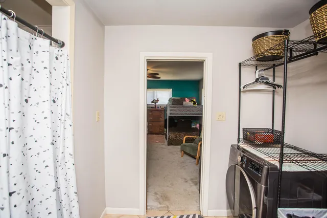a picture of a bathroom with a bathtub and a window