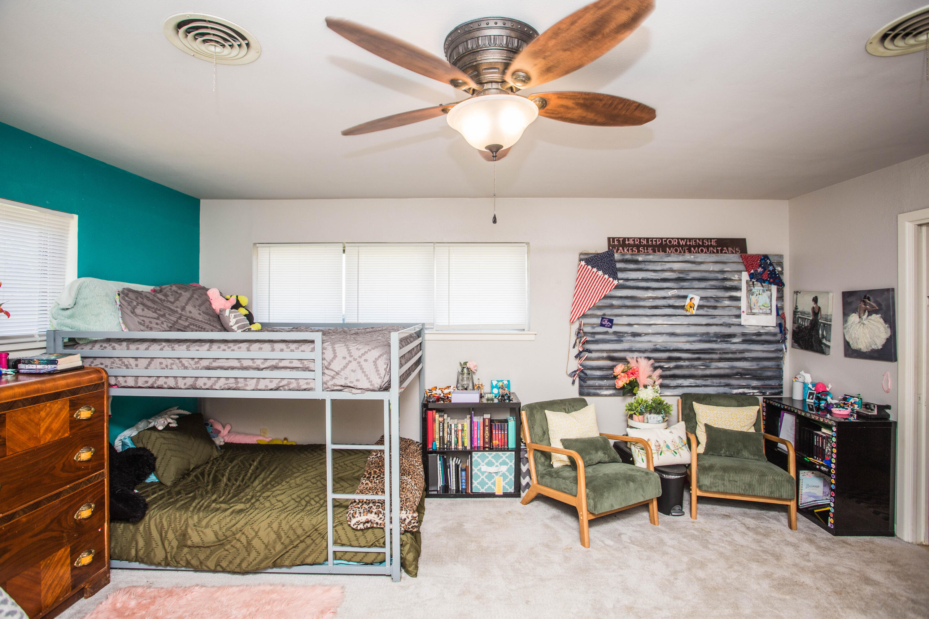 812 1st Street Abernathy, TX 79311 - Photo 31 of 53 a bedroom with a bed and a chandelier
