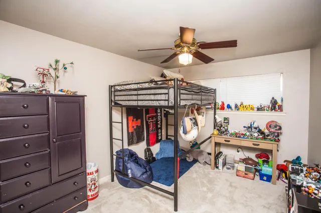 a bed room with furniture and a chandelier