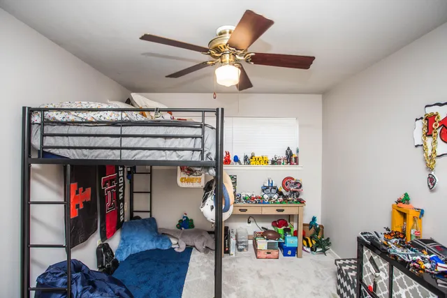 a kitchen with stainless steel appliances kitchen island granite countertop a sink stove and refrigerator