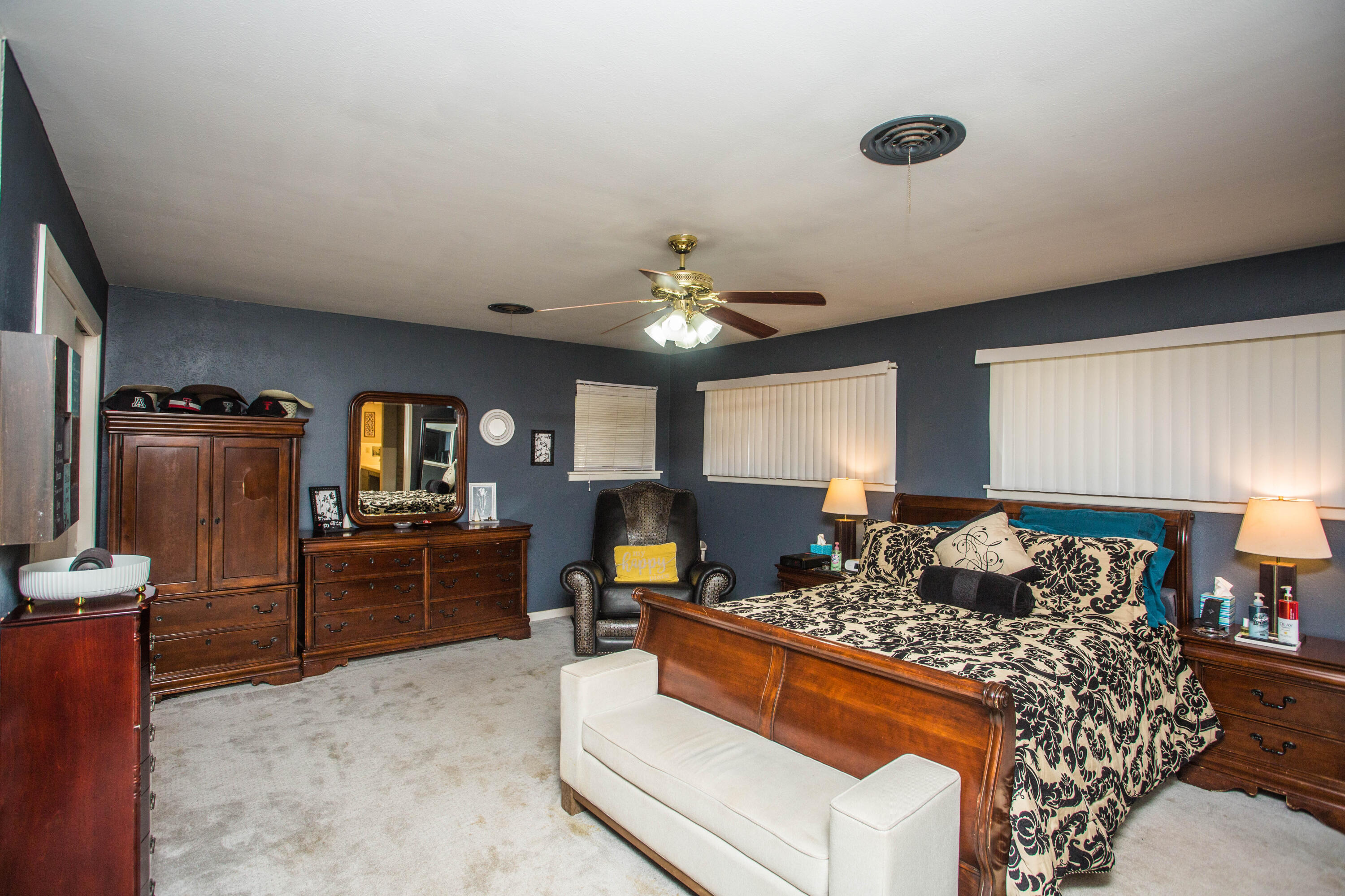 812 1st Street Abernathy, TX 79311 - Photo 37 of 53 a bed room with furniture and a chandelier