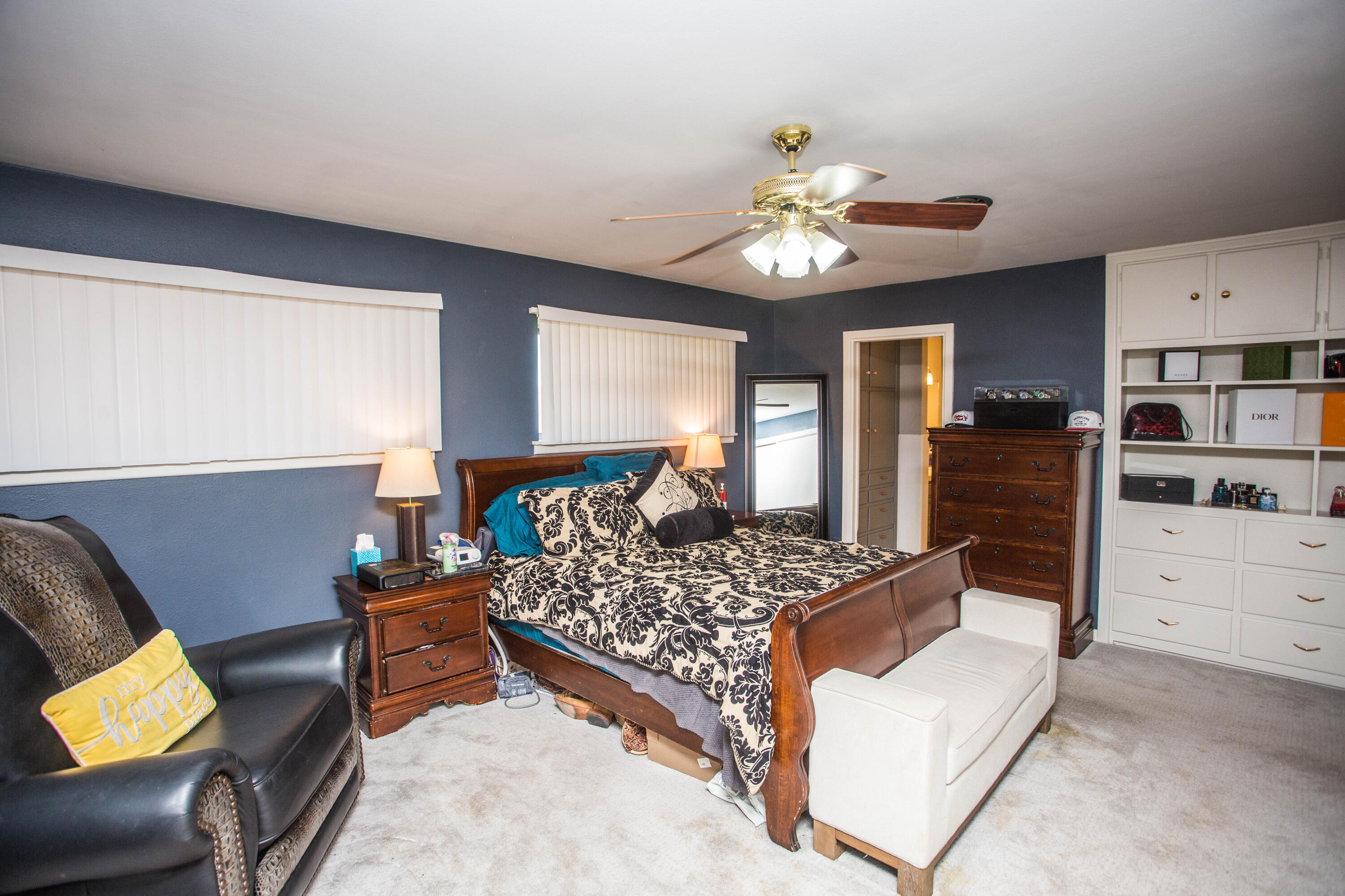 812 1st Street Abernathy, TX 79311 - Photo 40 of 53 a bedroom with a bed and a chandelier