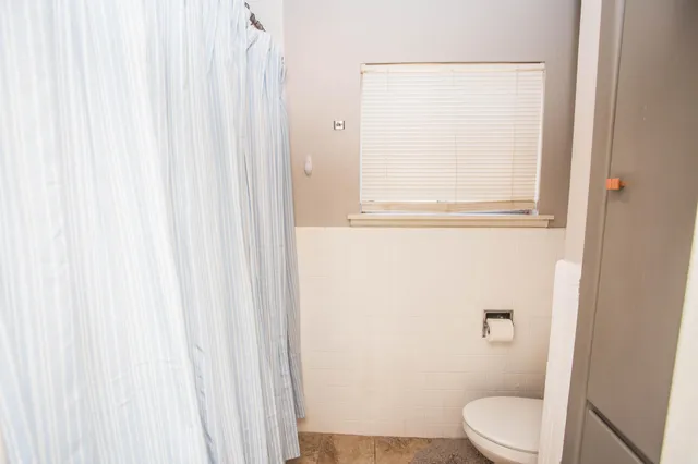 a kitchen with a sink and a refrigerator