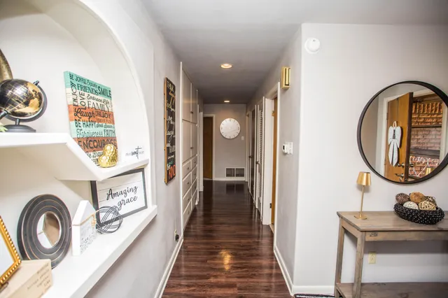 a view of a entryway door with wooden floor
