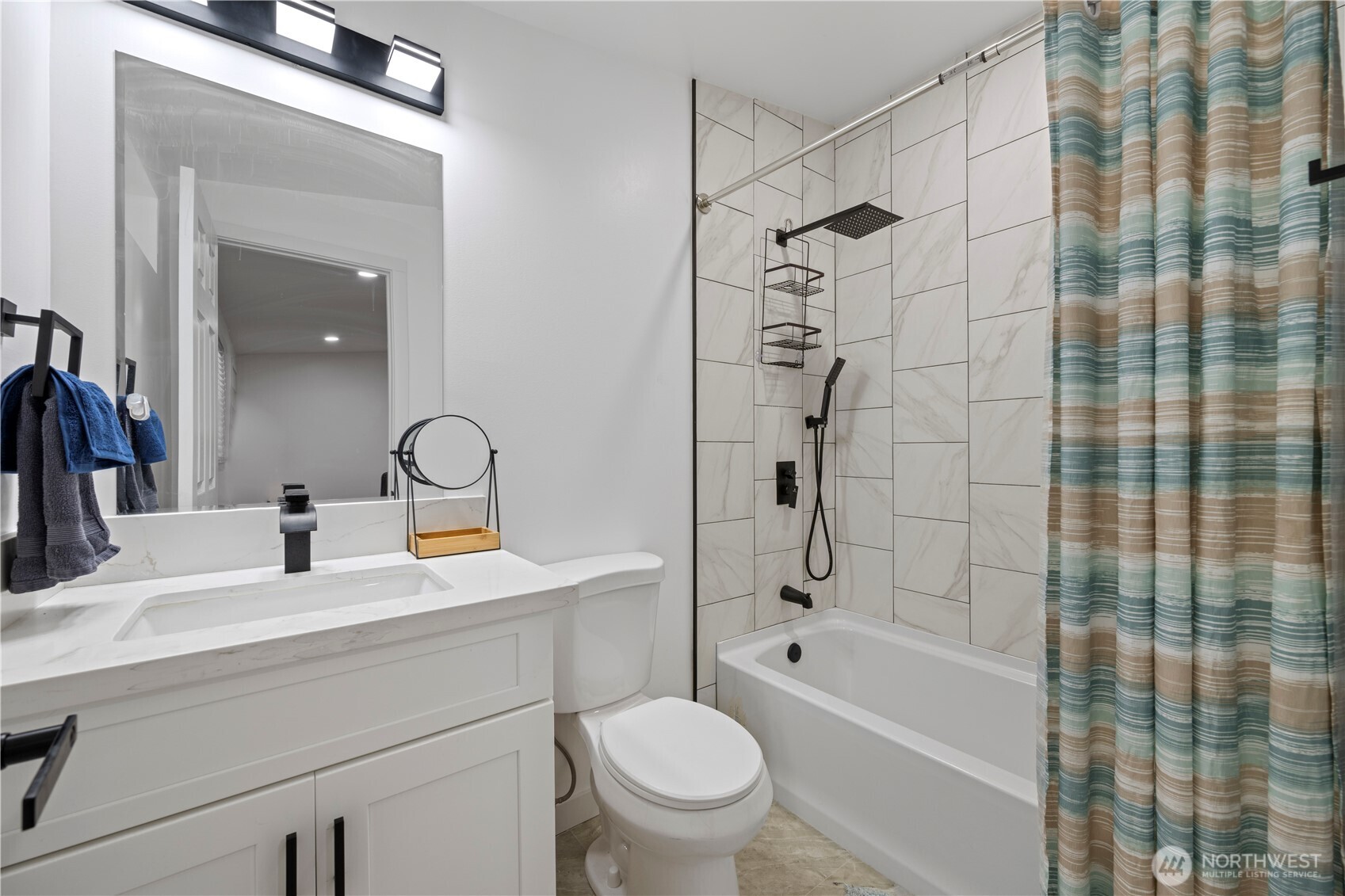 415 Lakeview Road, Unit K35 Lynnwood, WA 98087 - Photo 16 of 27 a bathroom with a sink toilet and shower
