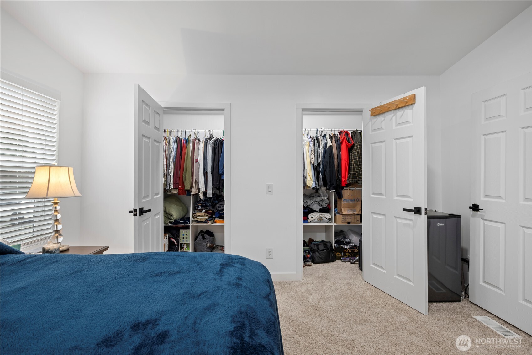 415 Lakeview Road, Unit K35 Lynnwood, WA 98087 - Photo 20 of 27 a view of a bedroom with wooden floor and closet