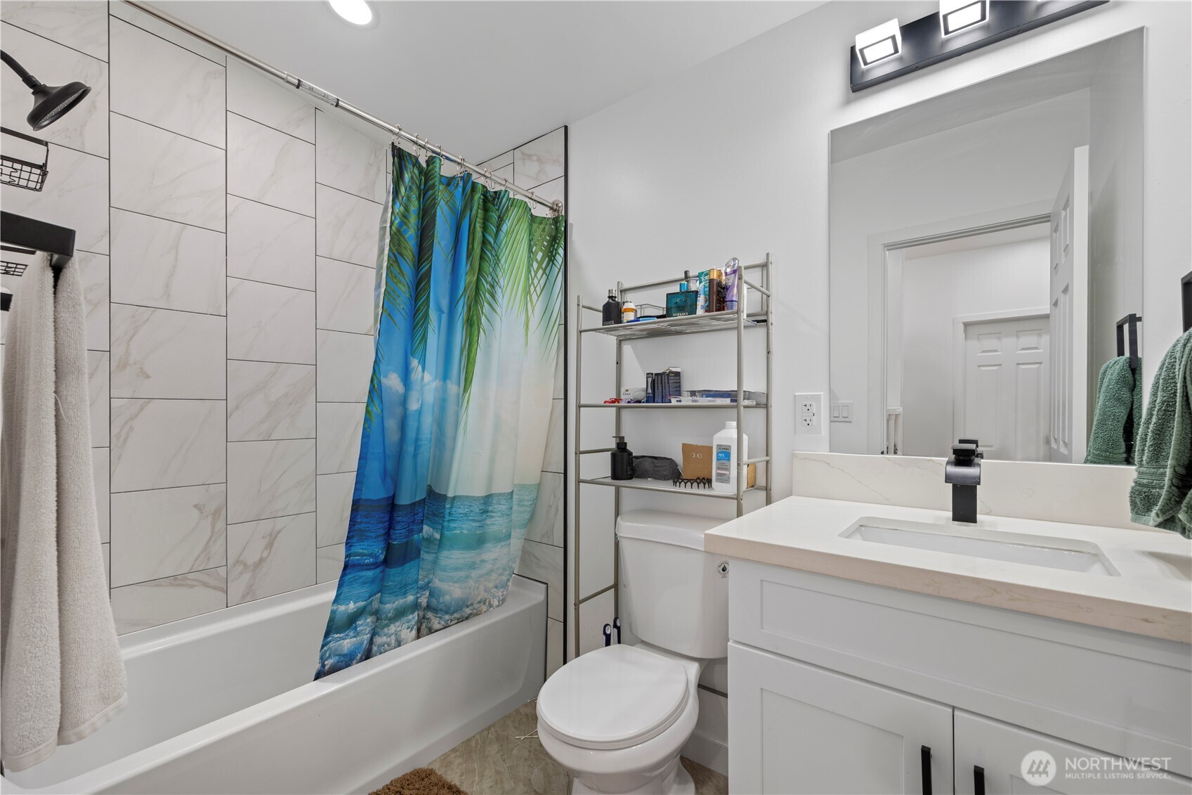 415 Lakeview Road, Unit K35 Lynnwood, WA 98087 - Photo 24 of 27 a bathroom with a sink toilet and shower